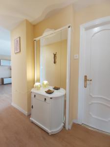 a bathroom with a shower and a white cabinet at Aurrekoetxea 36 Vacation Rental Tala 10 in Bermeo +30 photos