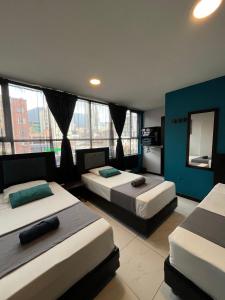 Postel nebo postele na pokoji v ubytování Hotel HILLS BOGOTA