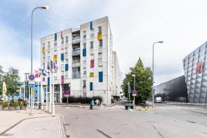 a large white building with colorful squares on it at Top floor near ferry terminal - free parking in Tallinn