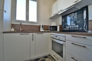 Η κουζίνα ή μικρή κουζίνα στο Appartement Proche Centre