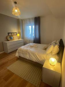 Postel nebo postele na pokoji v ubytování Spacieux appartement neuf - France