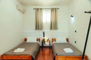 A bed or beds in a room at Kalypso studio Resorts