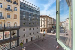 a view of a city street from a window at Corso Apartments in Rijeka