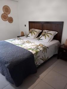 a bedroom with a bed with two pillows at Bella Loire in Le Monteil