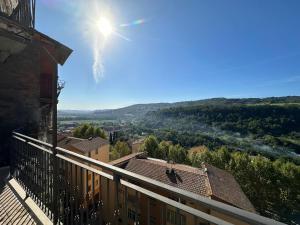 a view from a balcony with the sun in the sky at La Civetta - Casa vacanze Orte in Orte
