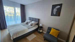 Postel nebo postele na pokoji v ubytování Apartament 7, Bryza, Augustów nad Jeziorem Necko + 11 fotografií