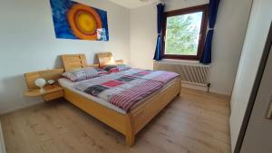 Posteľ alebo postele v izbe v ubytovaní Cottage Alpenblick