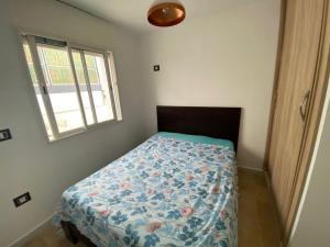 Una cama o camas en una habitación de Rooftop La Marsa