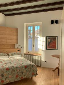 Postel nebo postele na pokoji v ubytování B&B Villa Cortese