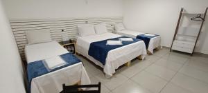 Ένα ή περισσότερα κρεβάτια σε δωμάτιο στο Millenium Hotel
