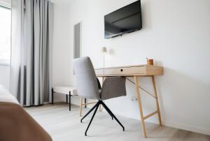 TV a/nebo společenská místnost v ubytování LaMiaCasa Green Suite Terrace Near City Center