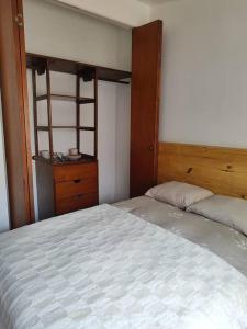 a bedroom with a large bed and a dresser at Cómoda habitación independiente Miraflores in Lima +10 photos