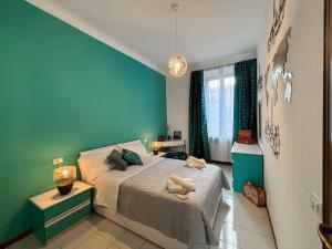 Ένα ή περισσότερα κρεβάτια σε δωμάτιο στο Elegant three-room apartment in Porta Romana Milano Cortina 2026 Winter Olympics