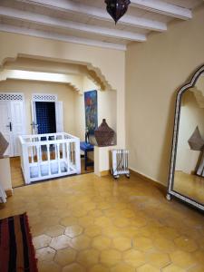 a living room with a large mirror and a table at Moroccan Riad With Panoramic Sea View in Essaouira