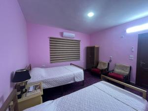 Postel nebo postele na pokoji v ubytování Al-Bustan House& Umm Qais