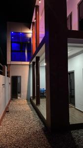 a hallway of a house with a view of a kitchen at Villa ORMACE in Lomé