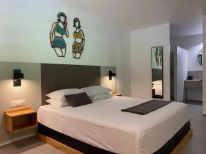 Krevet ili kreveti u jedinici u okviru objekta Hôtel Lune de Miel