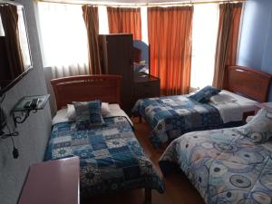 Letto o letti in una camera di Hostal Capri