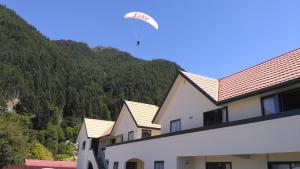 a kite flying in the sky above a building at Bella Vista Queenstown in Queenstown