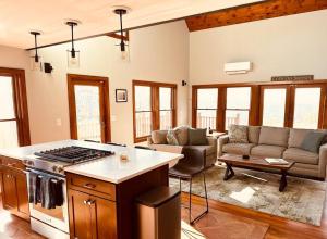 a living room with a stove and a couch at SRC-Hudson Valley, Berkshires Cultural Corridor in Canaan