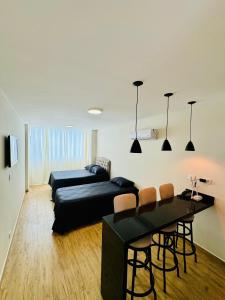 En eller flere senge i et værelse på kitnet Guarujá pitangueiras boulevard