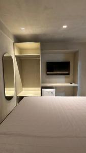 Postel nebo postele na pokoji v ubytování Loft 2 Edf celita Franca Business e flat