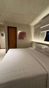 Postel nebo postele na pokoji v ubytování Loft 2 Edf celita Franca Business e flat