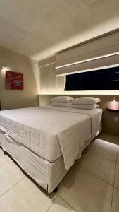Postel nebo postele na pokoji v ubytování Loft 2 Edf celita Franca Business e flat + 23 fotografií
