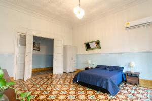 Postel nebo postele na pokoji v ubytování Casa Colonial en Manga