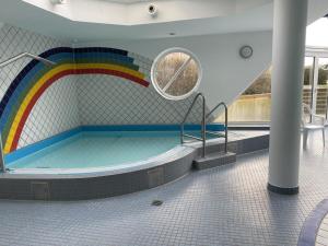 a pool with a rainbow on a cruise ship at 101 in the Vitamar holiday park in Dorum