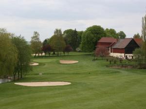 a view of a golf course with a green at Schlossblick Braunfels in Braunfels