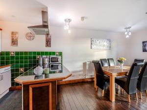 a kitchen and dining room with a table and chairs at The Drovers Rest - Uk43567 in Haltwhistle