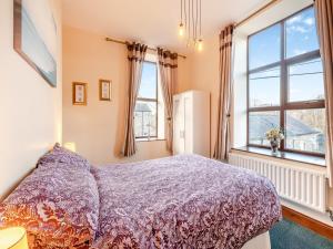 a bedroom with a bed and a large window at The Drovers Rest - Uk43567 in Haltwhistle +6 photos