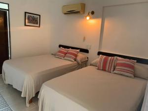 Postel nebo postele na pokoji v ubytování Hotel Quiloma Ranch