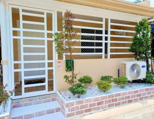 a front door of a house with a window at Catrionna Palace in La Filipina