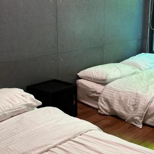 Voodi või voodid majutusasutuse 森旅行 toas