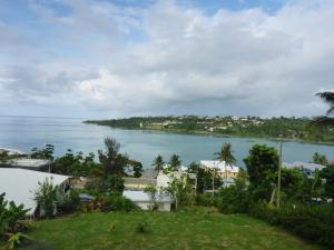 a view of the ocean from a house at Room With A View & Apartment Style in Port Vila