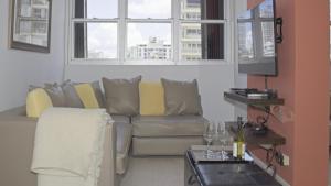 a living room with a couch and a table at Chefs Delight in San Juan