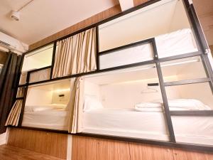 Bangkok Neighborhood Hostel客房内的一张或多张床位
