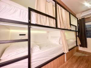 Bangkok Neighborhood Hostel客房内的一张或多张床位