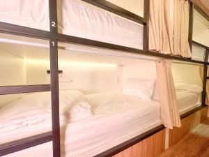 Bangkok Neighborhood Hostel客房内的一张或多张床位