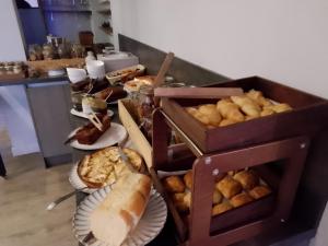 a table with a bunch of different types of food at Le Relais Des Trois Mas in Collioure