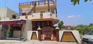 a building with a gate in front of it at Mallikarjun Residency with AC in Akalkot