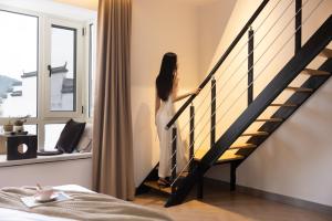 Voodi või voodid majutusasutuse 婺源县那湾那月民宿婺女洲店 toas