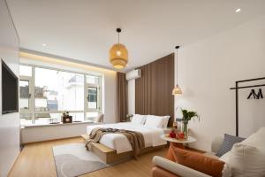 Voodi või voodid majutusasutuse 婺源县那湾那月民宿婺女洲店 toas