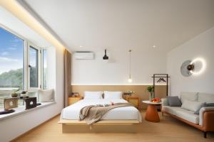 Voodi või voodid majutusasutuse 婺源县那湾那月民宿婺女洲店 toas