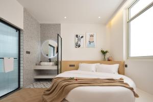 Voodi või voodid majutusasutuse 婺源县那湾那月民宿婺女洲店 toas