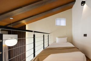 Voodi või voodid majutusasutuse 婺源县那湾那月民宿婺女洲店 toas