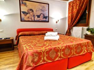 Llit o llits en una habitació de Ca Miracoli