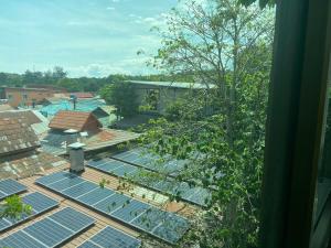 an image of solar panels on the roof of a house at A Plus Deluxe Hotel in Ko Lipe